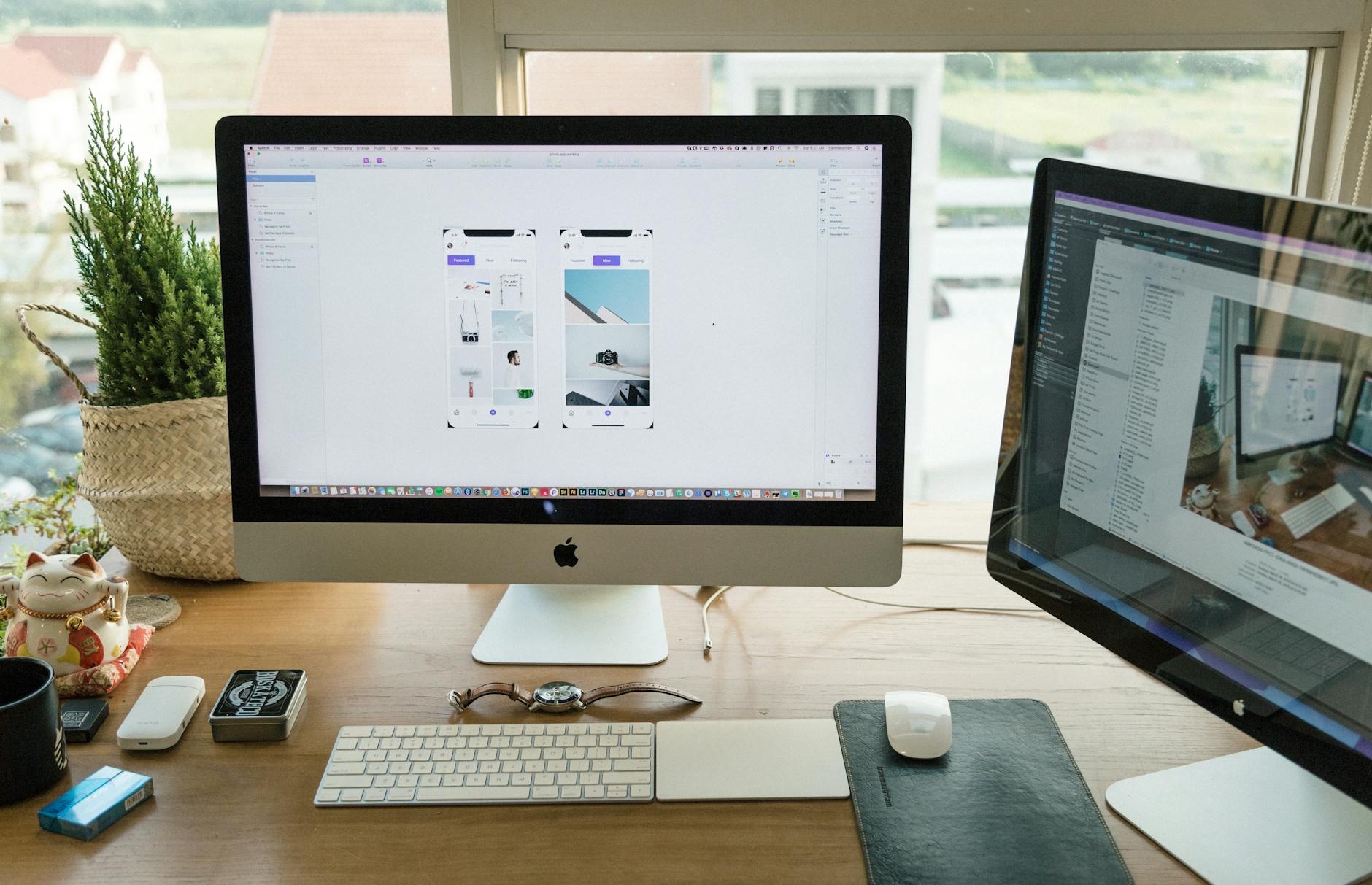 Professional office workspace with multiple monitors for business website management