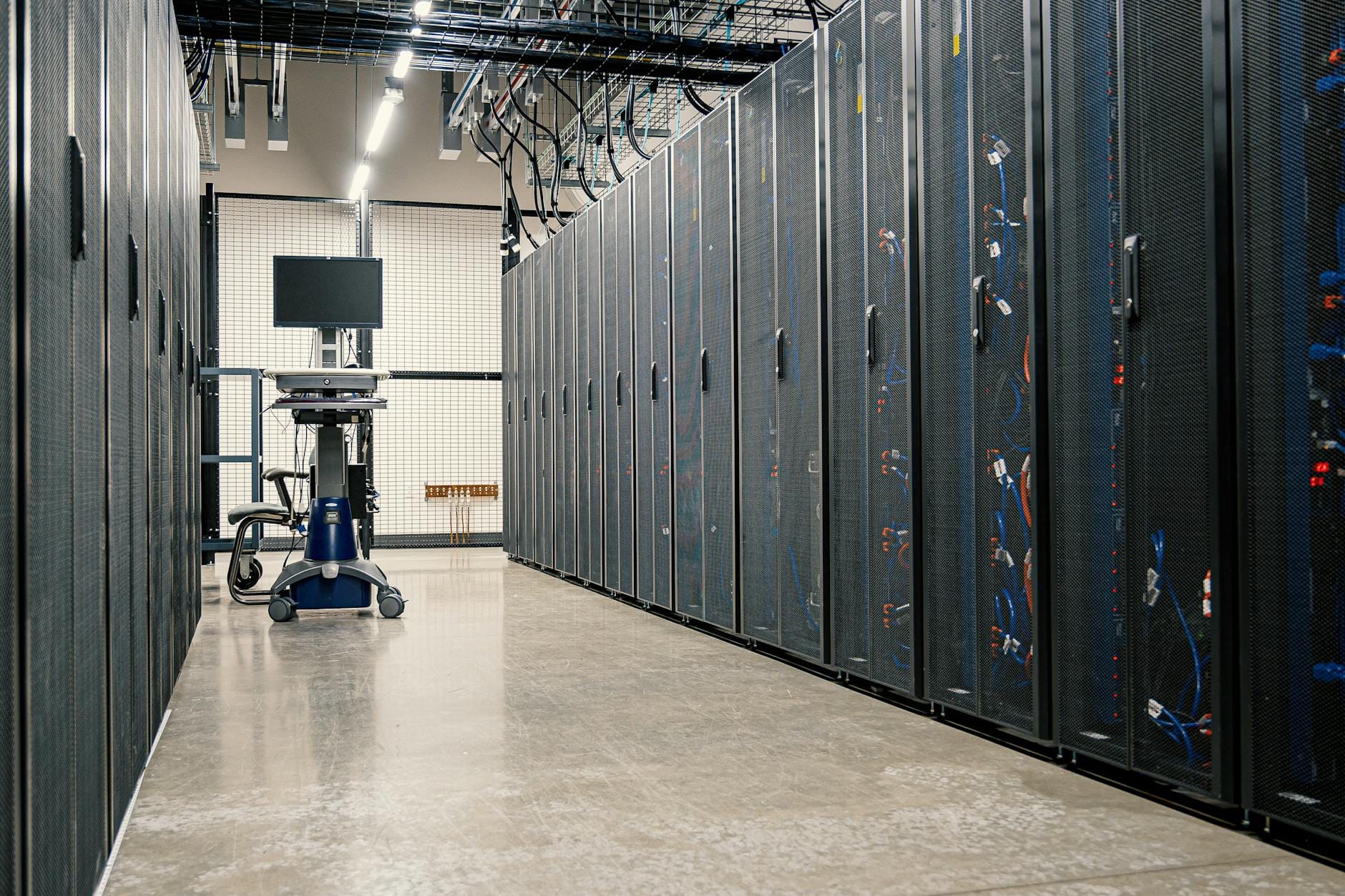 Data center server corridor representing hosting infrastructure