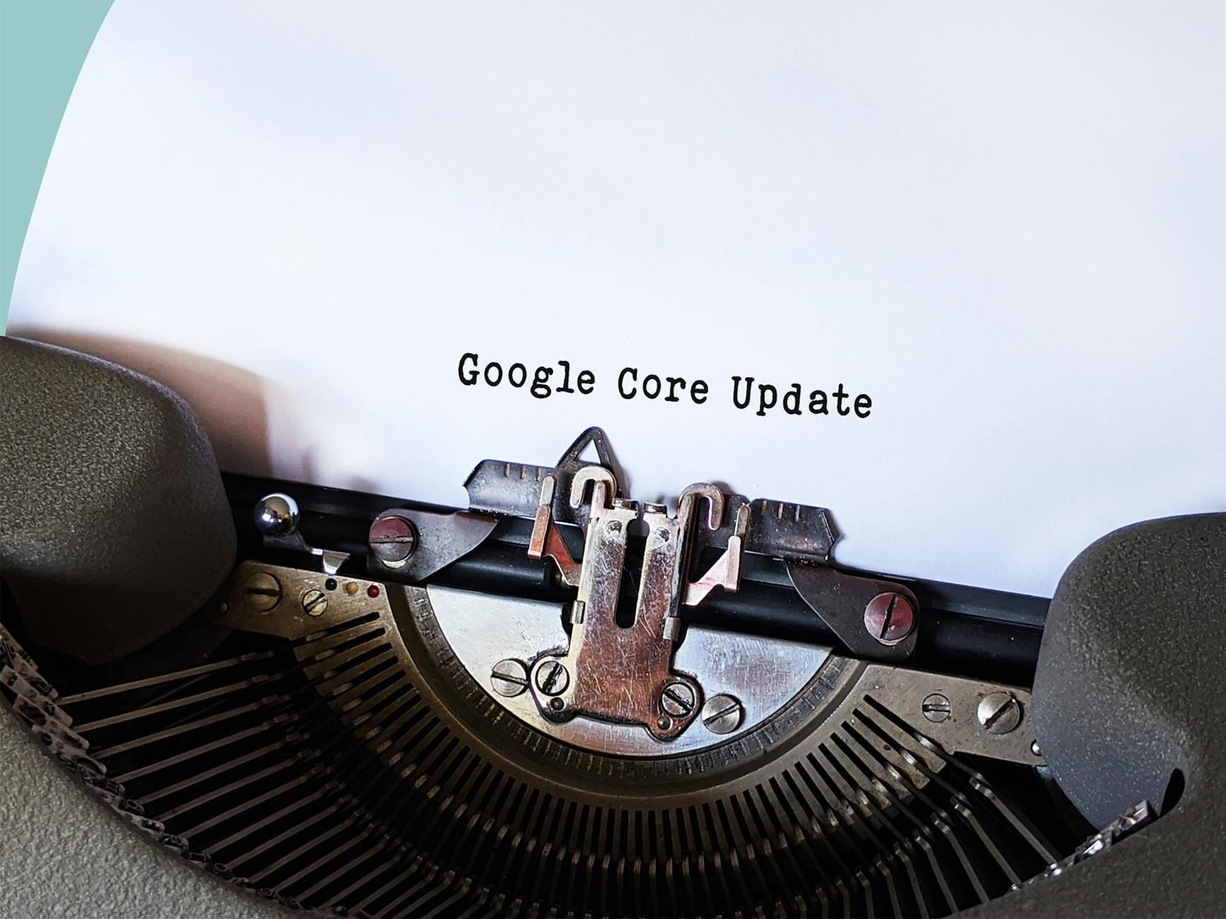 How to Migrate Your Website to a New Host (Step-by-Step Guide) - Close-up of a typewriter typing 'Google Core Update' on pape