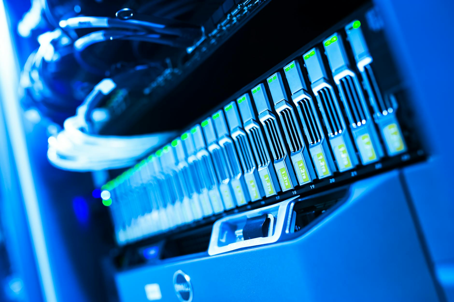 Is Free Web Hosting Worth It? The Hidden Costs That Make It Expensive - A detailed view of a blue lit computer server rack in