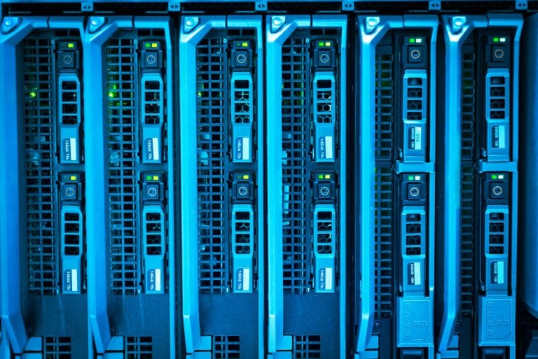 Web Hosting Uptime Explained: Why 99.9% Guarantee Matters for Your Business - Detailed image of illuminated server racks show