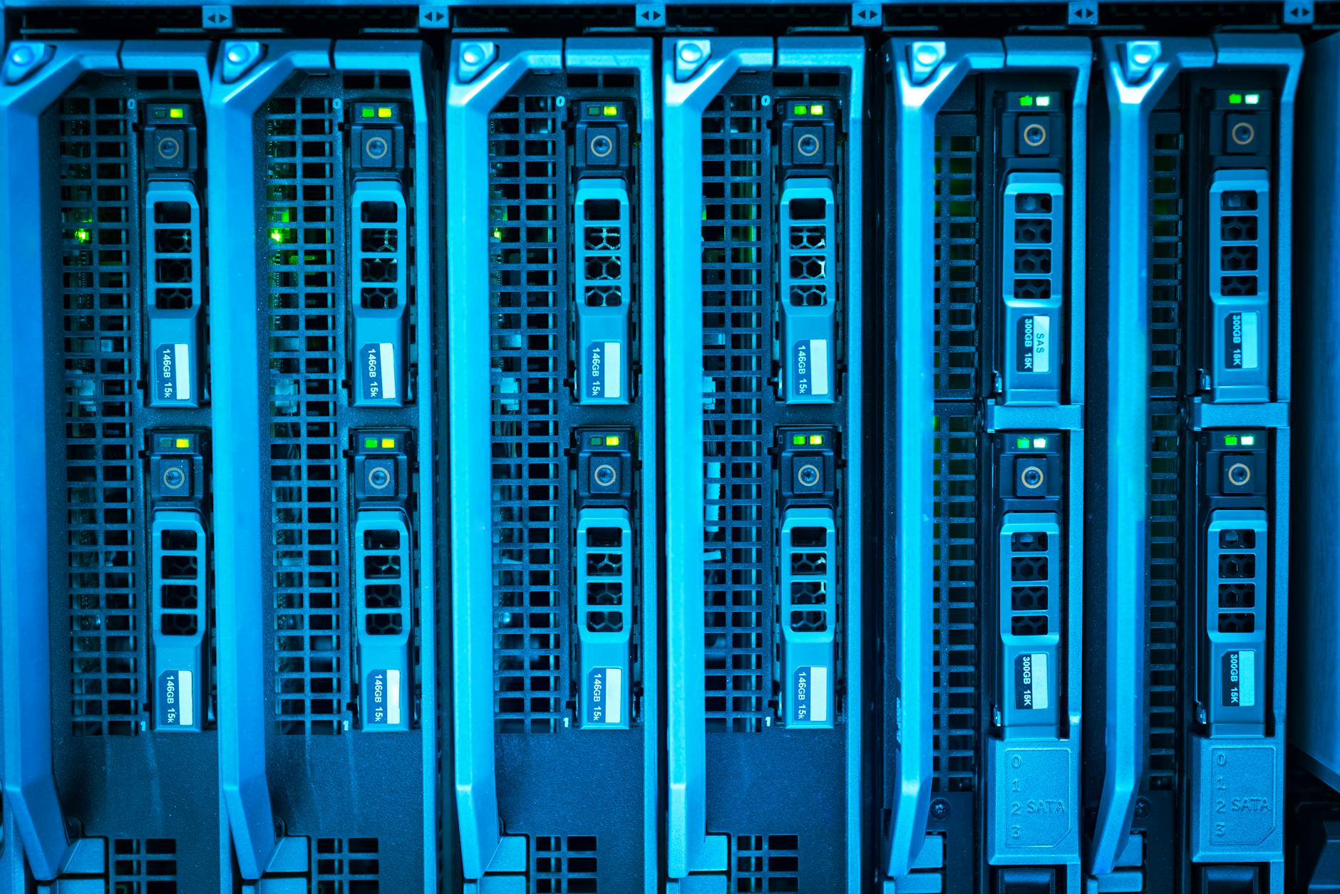 Web Hosting Uptime Explained: Why 99.9% Guarantee Matters for Your Business - Detailed image of illuminated server racks show